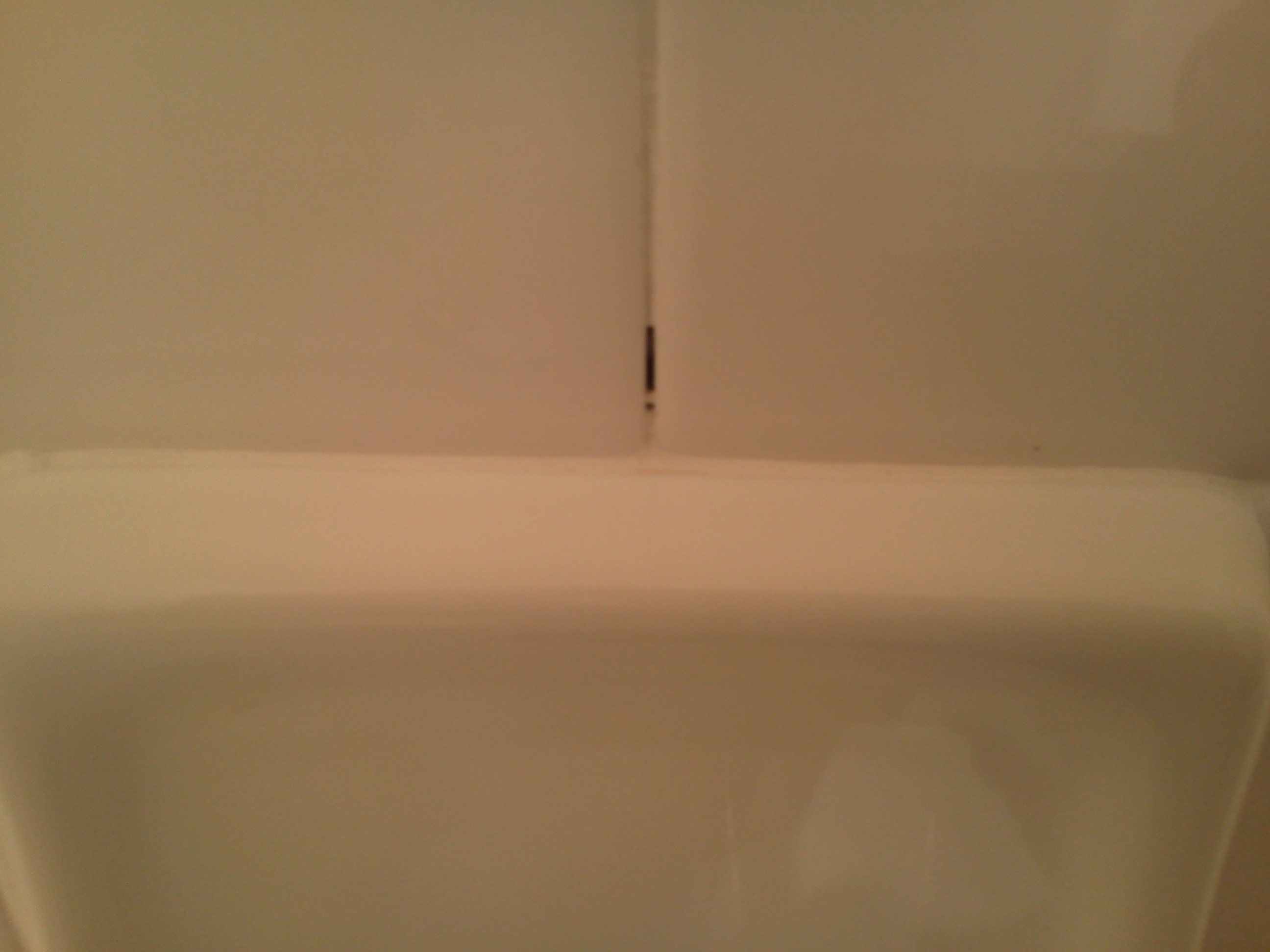 How do you repair shower grout?